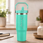 Personalised aqua green insulated travel cup with large engraved name and flip straw