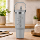 Personalised grey insulated travel cup with large engraved name and flip straw