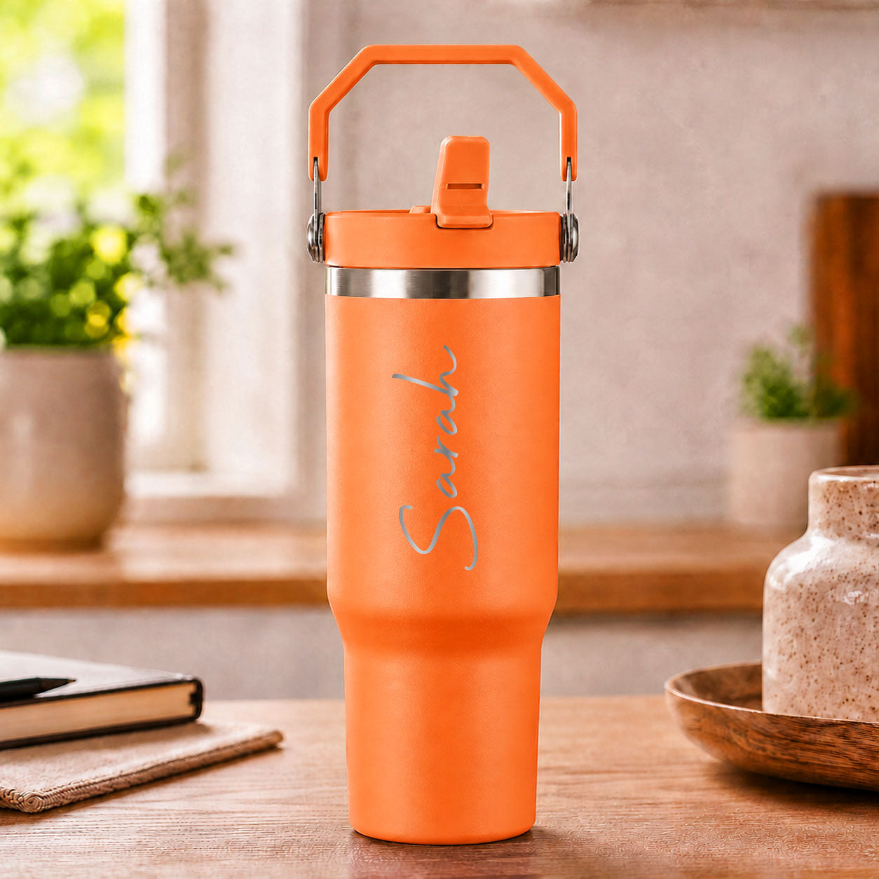 Personalised orange insulated travel cup with large engraved name and flip straw