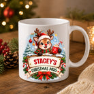 Personalised reindeer Christmas mug in glossy white ceramic with a name on a wooden sign