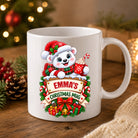 Personalised polar bear Christmas mug in glossy white ceramic with a name on a wooden sign